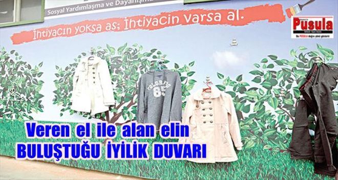 Veren el ile alan elin buluştuğu iyilik duvarı
